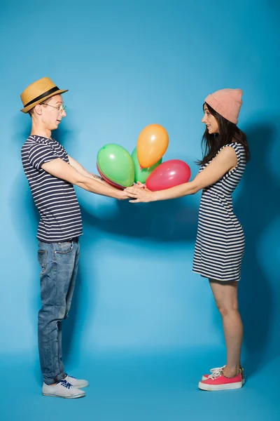 Funny couple in love with balls  the studio — Stock Photo, Image