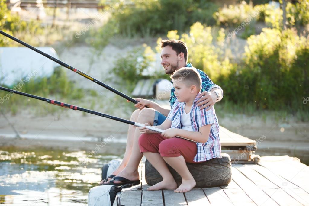 Man and boy fishing on the lake — Stock Photo © MrCat.com.ua #87374824