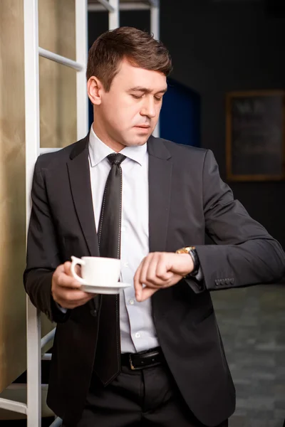 Attentive businessman writing on notebook at office — Stock Photo, Image