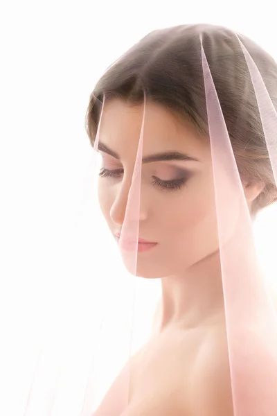 Portrait of a woman. Bride with a pink veil. — Stock Photo, Image