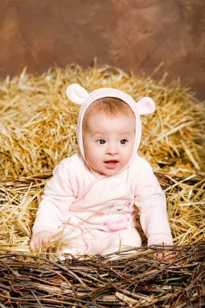 Little girl. child in pink overalls with ears. — Stock Photo, Image