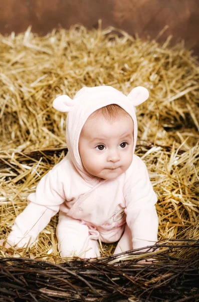 Little girl. child in pink overalls with ears. — Stock Photo, Image