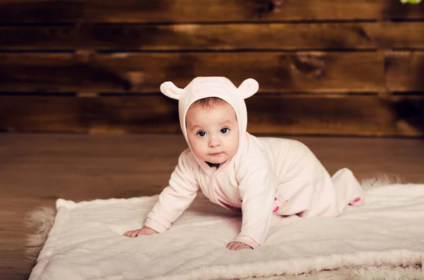 Little girl. child in pink overalls with ears. — Stock Photo, Image