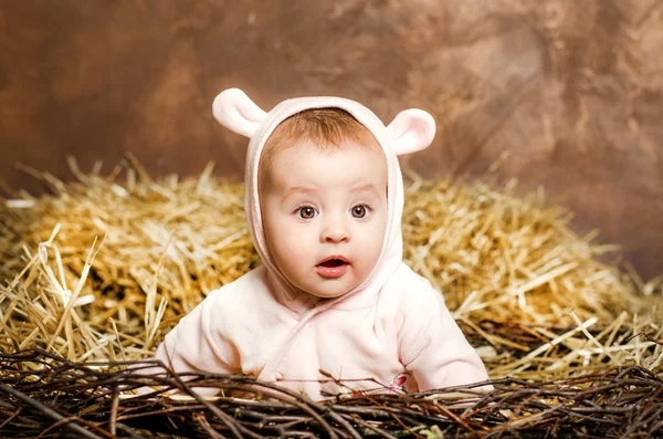 Little girl. child in pink overalls with ears. — Stock Photo, Image