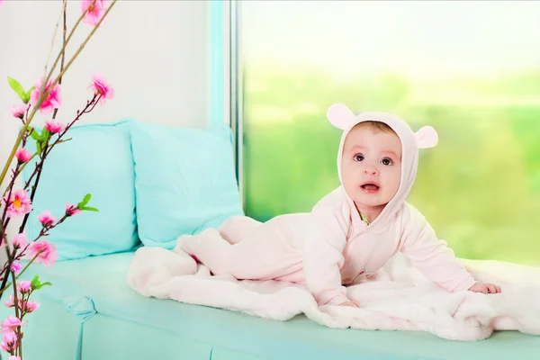 Little girl. child in pink overalls with ears. — Stock Photo, Image