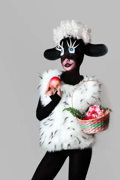 A girl dressed as a sheep. The unusual costume and body art. — Stock Image A girl dressed as a sheep. The unusual costume and body art. Royalty Free Stock Photos