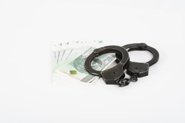 Kelepçe, para ve polis.