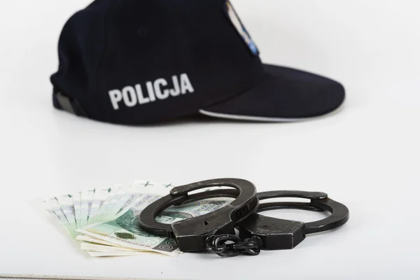 Handschellen, Geld und Polizei. — Stockfoto