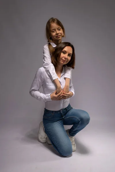 Mom Daughter Jeans White Shirts Gray Background Mothers Day Family — Stock Photo, Image