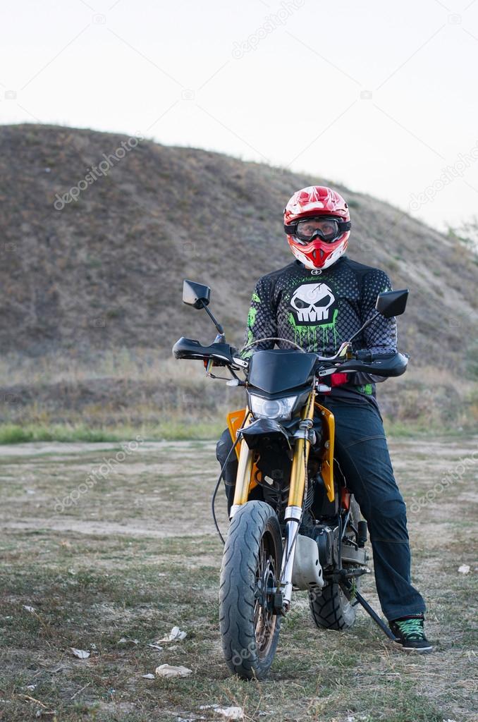 Rider on sport bike for enduro on motocross track