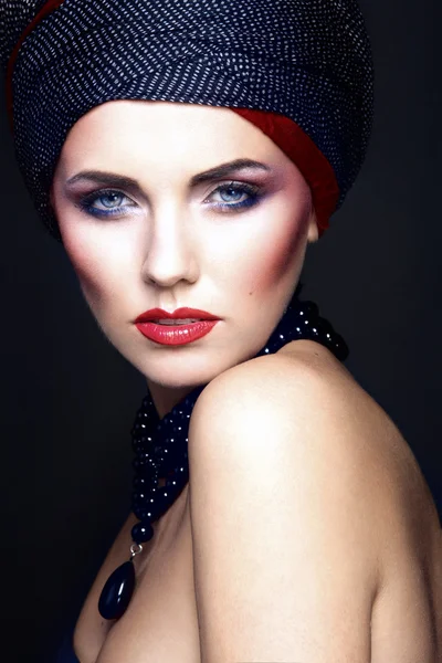 fashion portrait of a beautiful woman with blue eyes