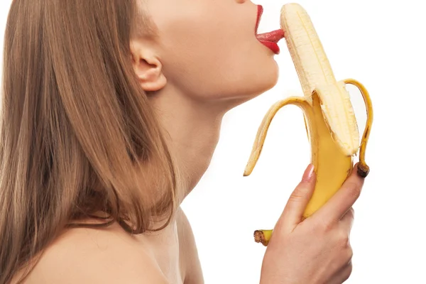 Horny girl eats and licks the banana, oral sex — Stock Photo, Image