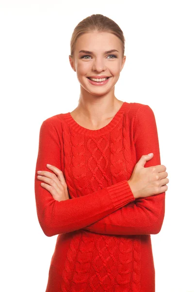 Модель позирует в красном платье на белом фоне Стоковое Изображение