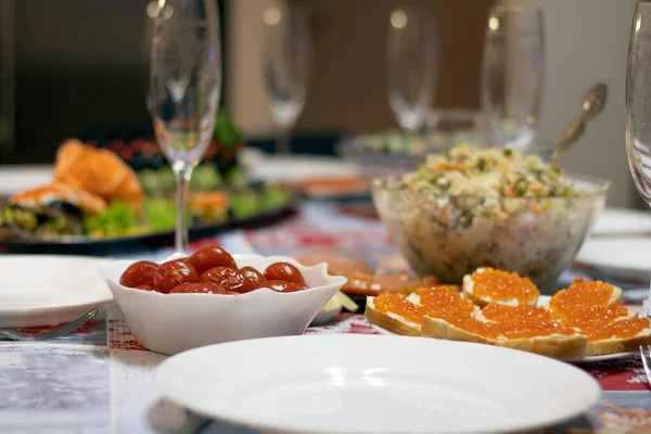 Festive table, table setting, the table is beautifully decorated with various dishes and appetizer salads.