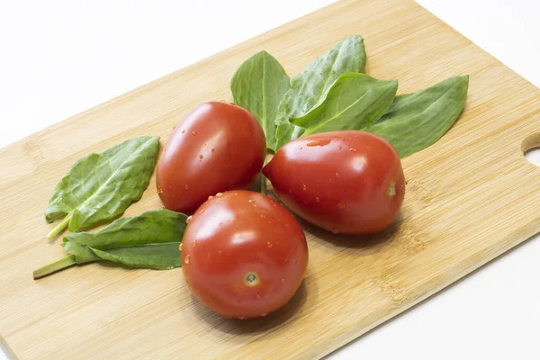 Tomatoes Sorrel Wooden Cutting Board — Stock Photo, Image