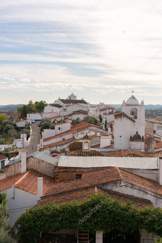 Terena village white traditional houses and church seen from the castle, in Portugal