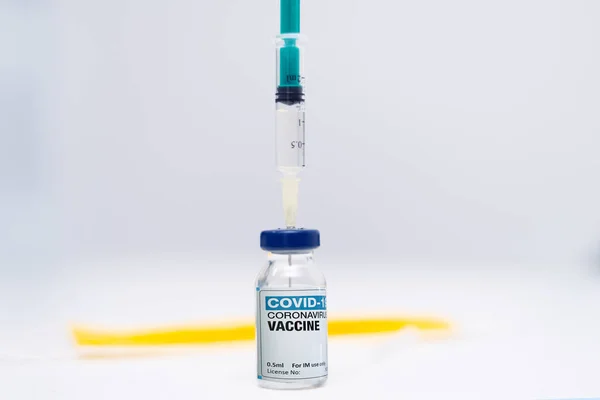 Covid-19 Corona Virus 2019-ncov vaccine vials medicine drug bottles syringe injection. Vaccination, immunization, treatment to cure Covid 19 Corona Virus infection. Healthcare And Medical concept.