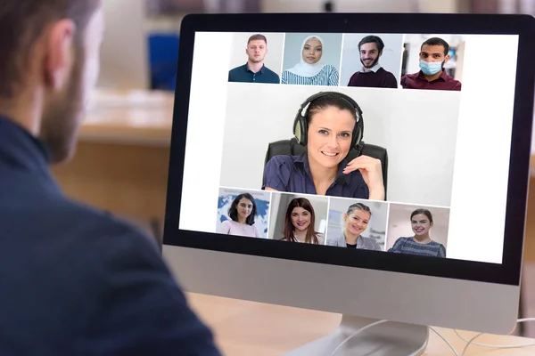 Online remote school class concept. Mixed race college student distance learning using computer conferencing with teacher and classmates group.Teaching and learning from home during quarantine and coronavirus outbreak.