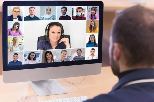 Online remote school class concept. Mixed race college student distance learning using computer conferencing with teacher and classmates group.Teaching and learning from home during quarantine and coronavirus outbreak.