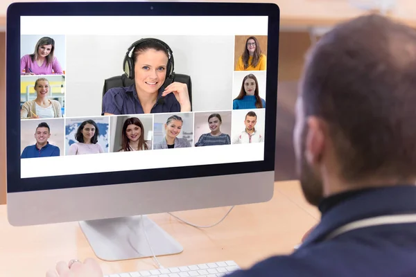 Online remote school class concept. Mixed race college student distance learning using computer conferencing with teacher and classmates group.Teaching and learning from home during quarantine and coronavirus outbreak.