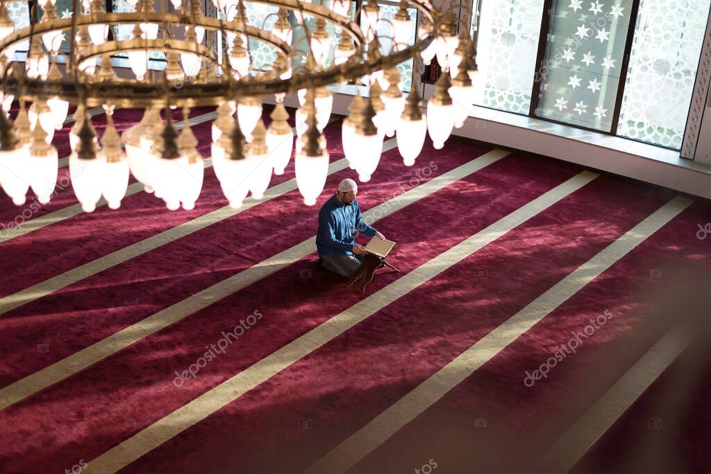 Muslim Man Reading Holy Book (Qur'an) Inside The Mosque