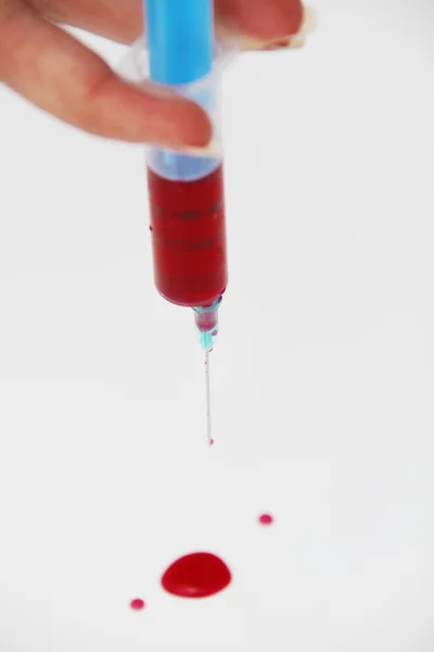 Syringe of Red Blood Test for research HIV AIDS Concept Idea — Stock Photo, Image