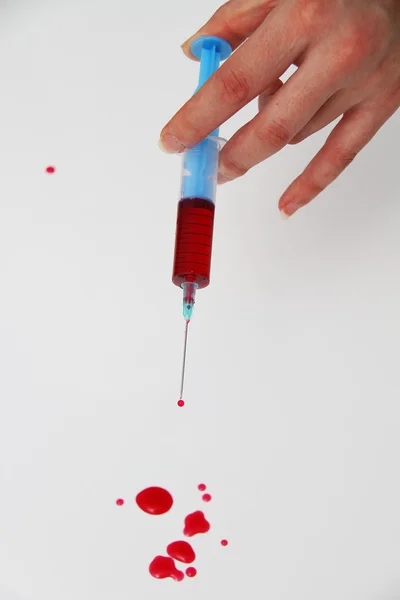 Syringe of Red Blood Test for research HIV AIDS Concept Idea — Stock Photo, Image