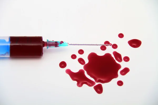 Syringe of Red Blood Test for research HIV AIDS Concept Idea — Stock Photo, Image