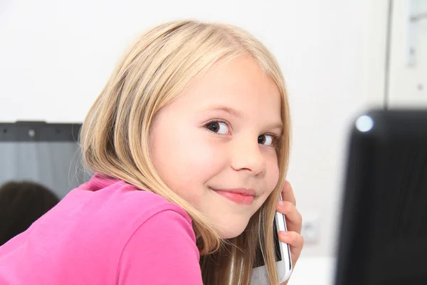 Little child playing at home with tablet, laptop and phone — Stock Photo, Image