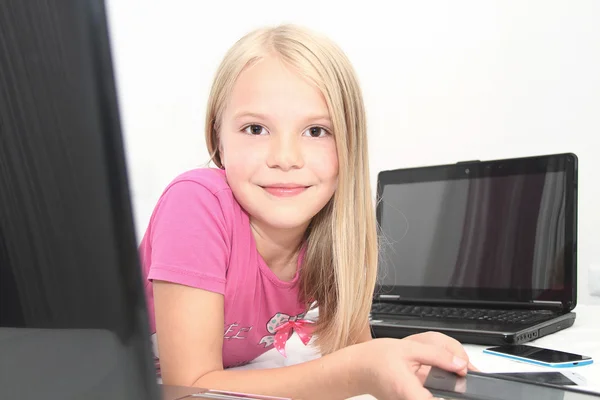 Little child playing at home with tablet, laptop and phone — Stock Photo, Image