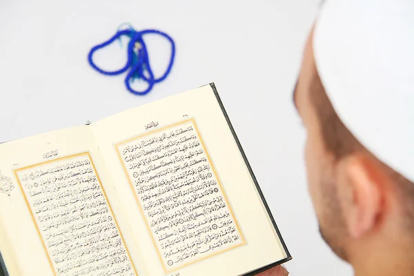 Young man reading the Holy Koran — Stock Photo, Image