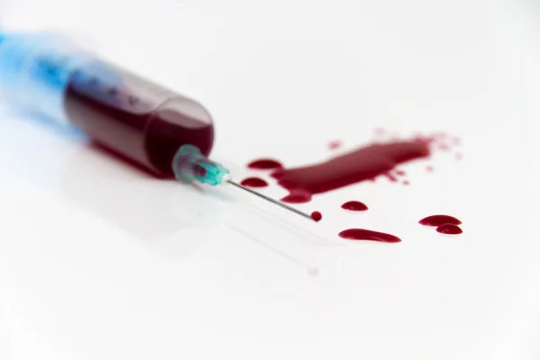 Syringe of Red Blood Test for research HIV AIDS Concept Idea — Stock Photo, Image