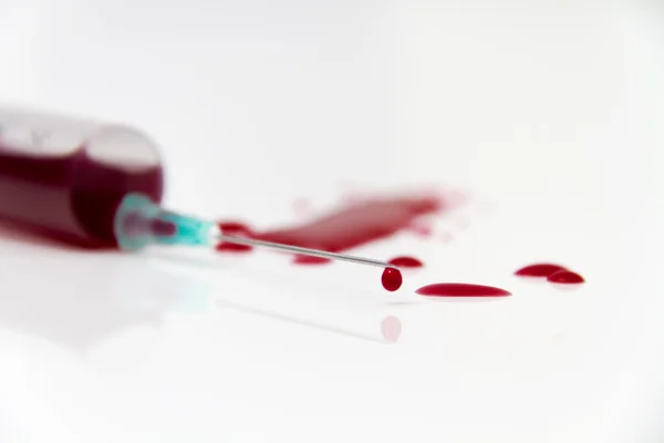 Syringe of Red Blood Test for research HIV AIDS Concept Idea — Stock Photo, Image