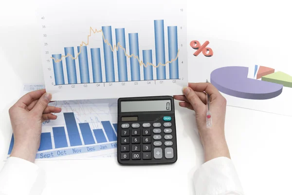 Young businesswoman calculating financial documents — Stock Photo, Image