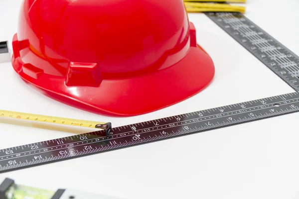 Helmet and tools for construction drawings and buildings — Stock Photo, Image