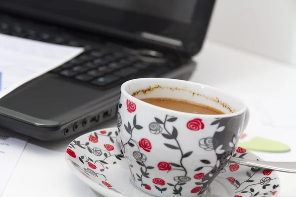 Businessman  with coffee and laptop analyzing of the  monitoring — Stock Photo, Image