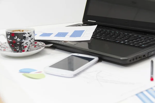 Businessman  with coffee and laptop analyzing of the  monitoring — Stock Photo, Image