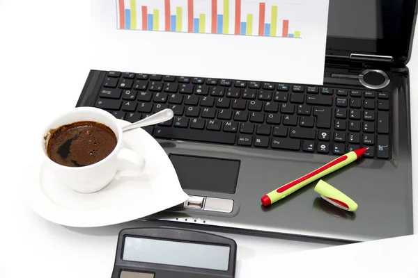 Analyzing business investment charts with calculator and laptop — Stock Photo, Image