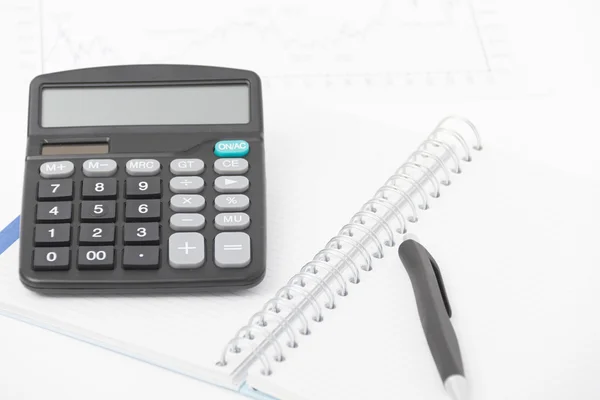 Business concept with calculator, pen and notebook — Stock Photo, Image