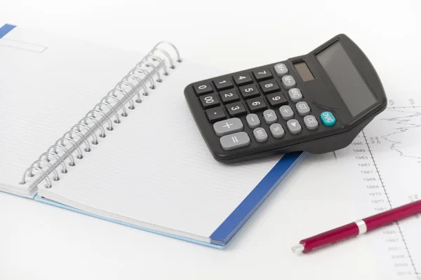 Affärsidé med miniräknare, penna och anteckningsbok — Stockfoto