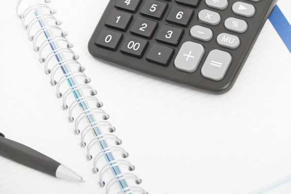 Business concept with calculator, pen and notebook — Stock Photo, Image