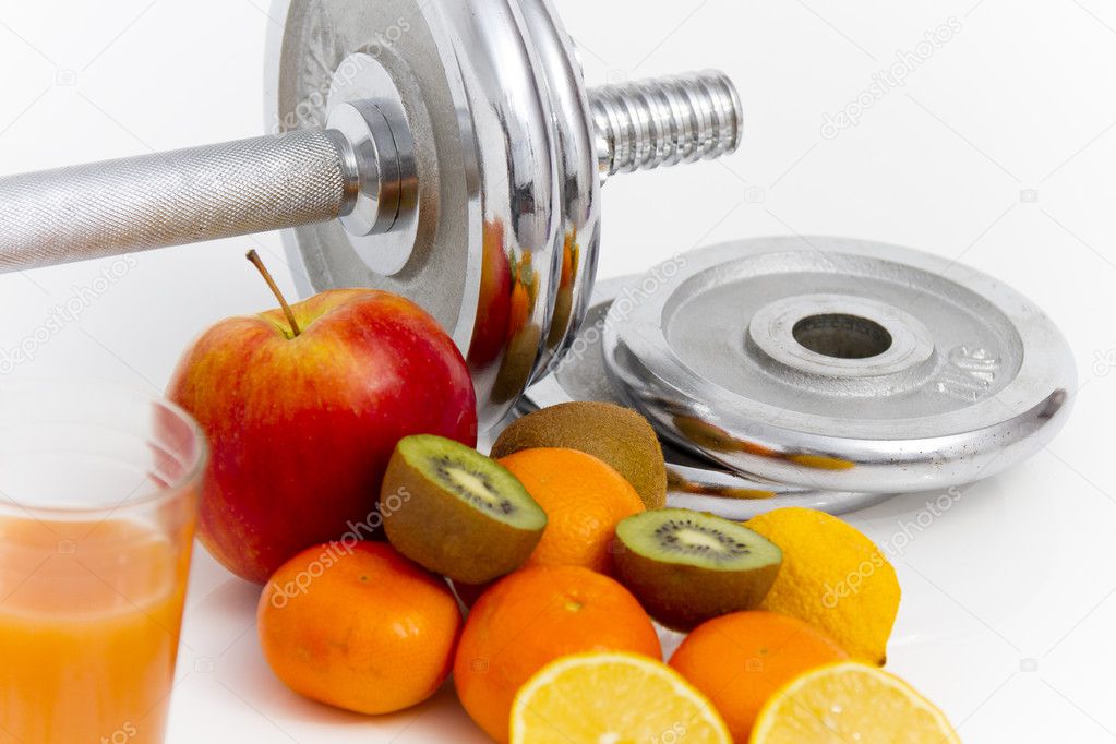 Fitness equipment and healthy food, apple, nectarines, kiwi, lem