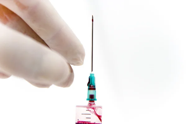 Syringe in laboratory environment — Stock Photo, Image