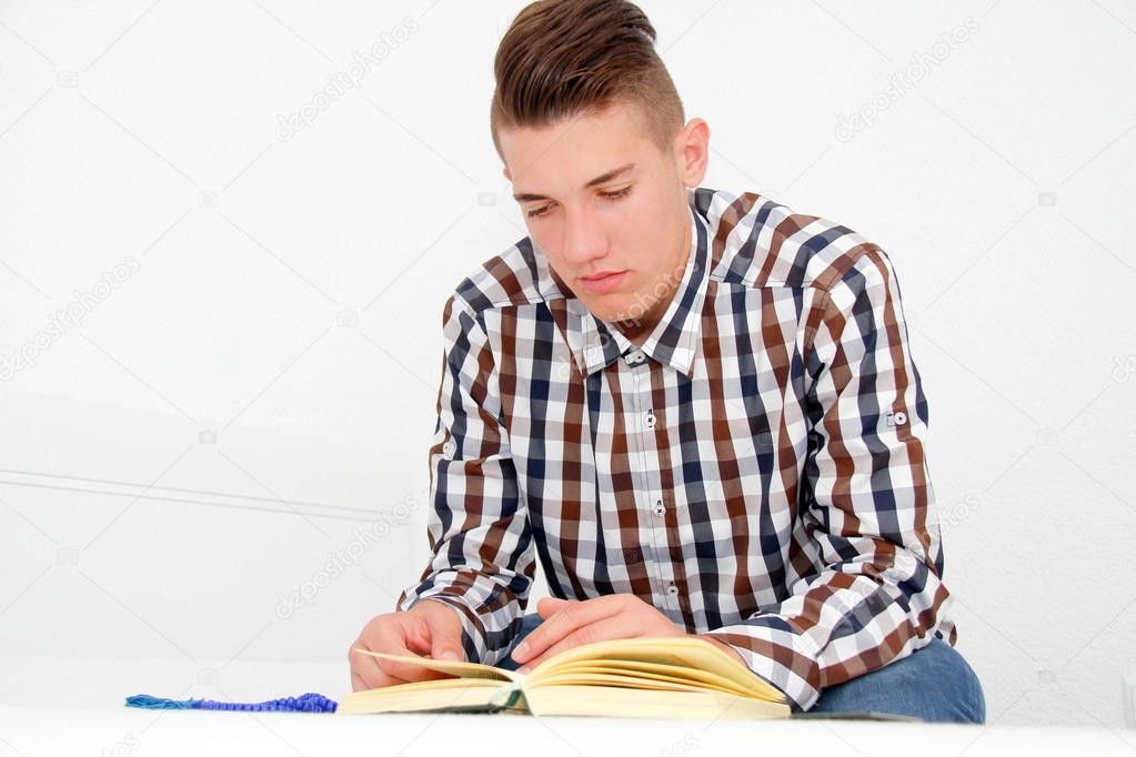 Young man reading the Holy Koran