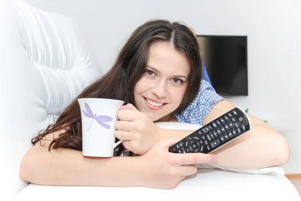 Young pretty woman enjoy watching tv — Stock Photo, Image