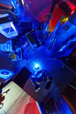 Blue laser in a quantum optics lab. clipart