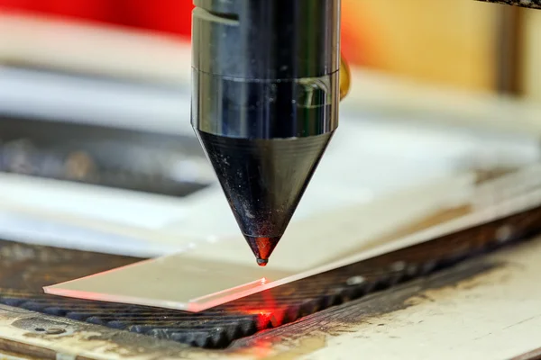 Red laser on cutting machine — Stock Photo, Image