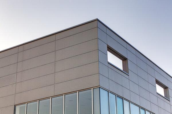 Details of gray facade made of aluminum panels on industrial building