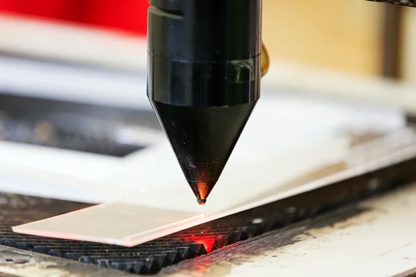 Red laser on cutting machine — Stock Photo, Image