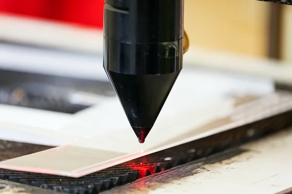 Red laser on cutting machine — Stock Photo, Image